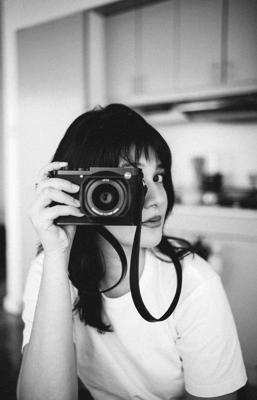 Illustrative photography page with a photographer holding a camera